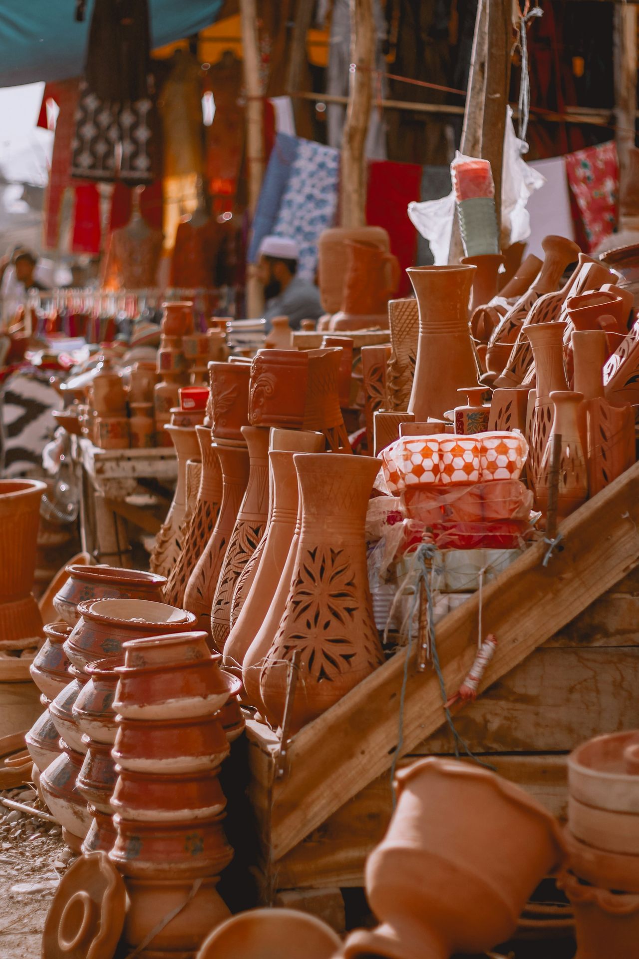 A lot of clay pots that are on a table